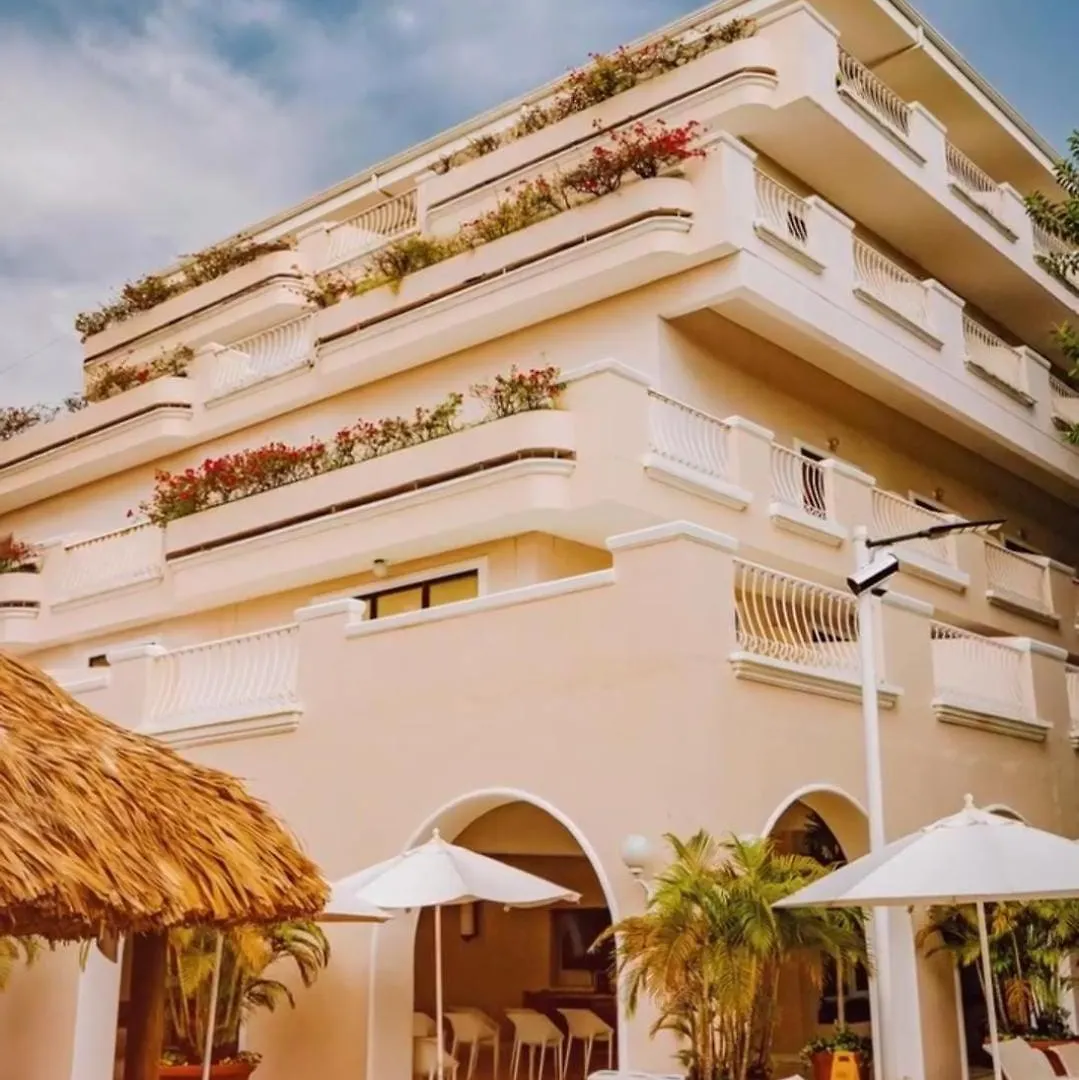 Flowering balconies and white balustrades on the facade of Hotel Tocarema