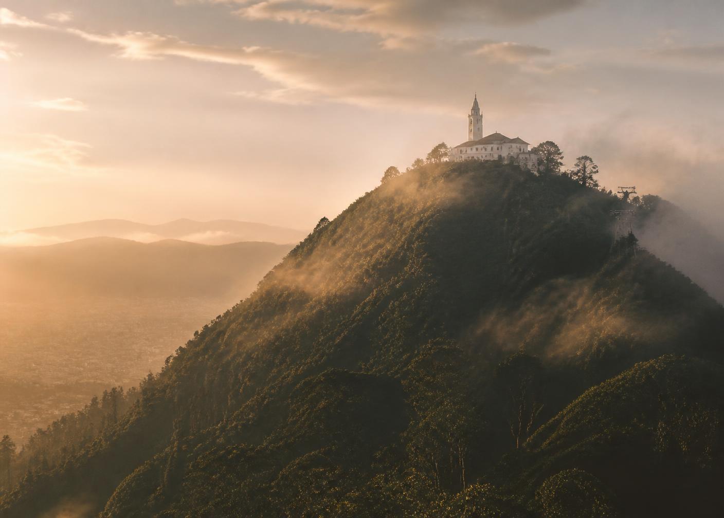 The white sanctuary of Monserrate above Bogotá in morning mist